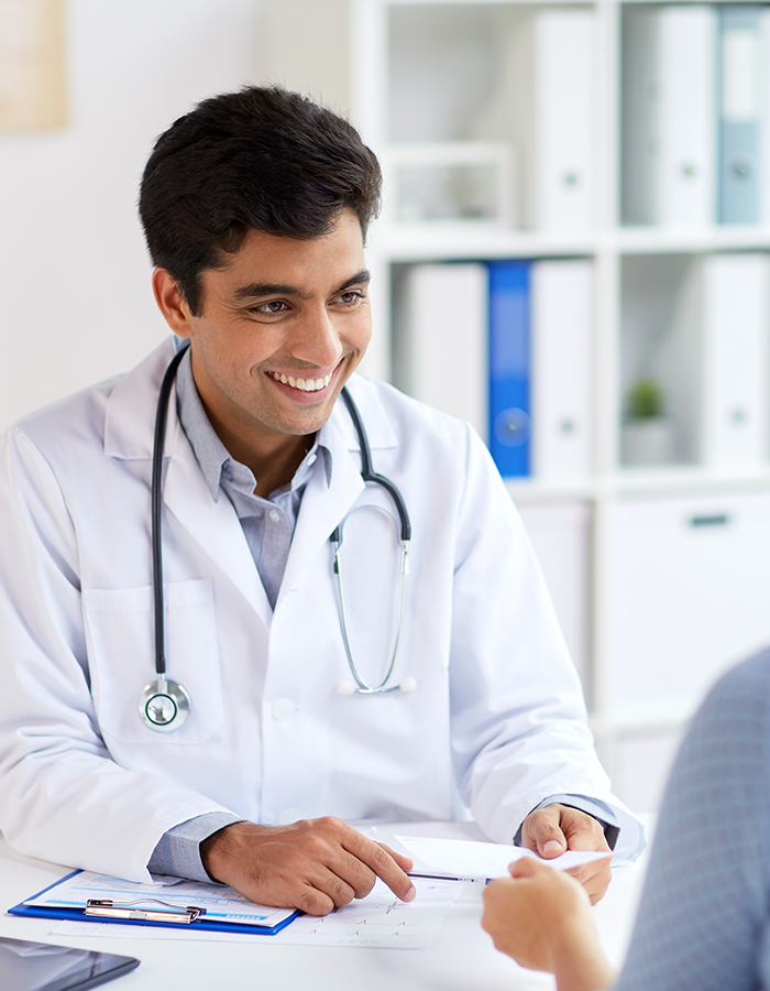 gp-prescription GP handing prescription to patient